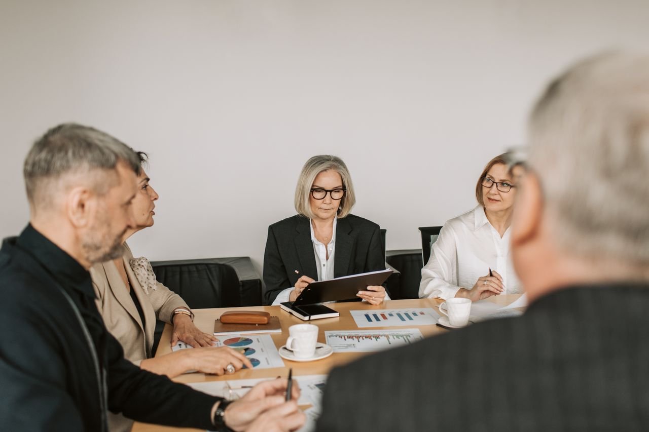 Medicare agents collaborating around a conference table