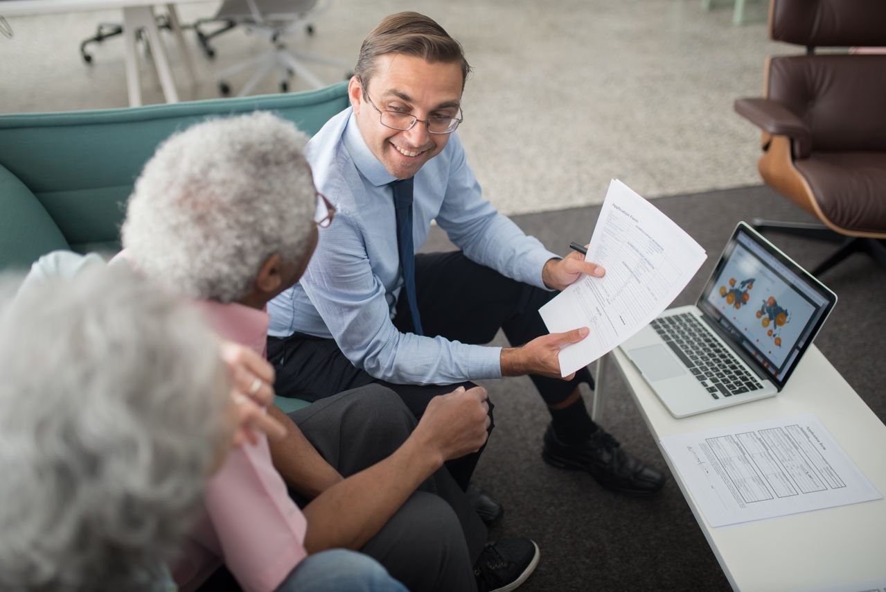 Senior reviewing Medicare options with a Goldway Capital advisor