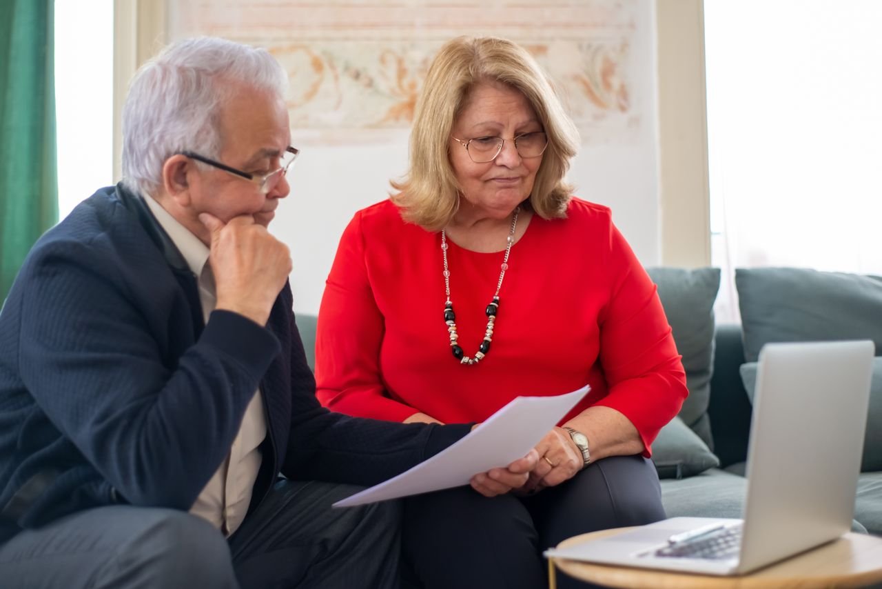 Senior couple discussing home financing options together
