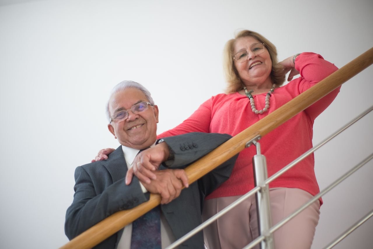 Senior homeowners age 62 and older outside their Georgia home